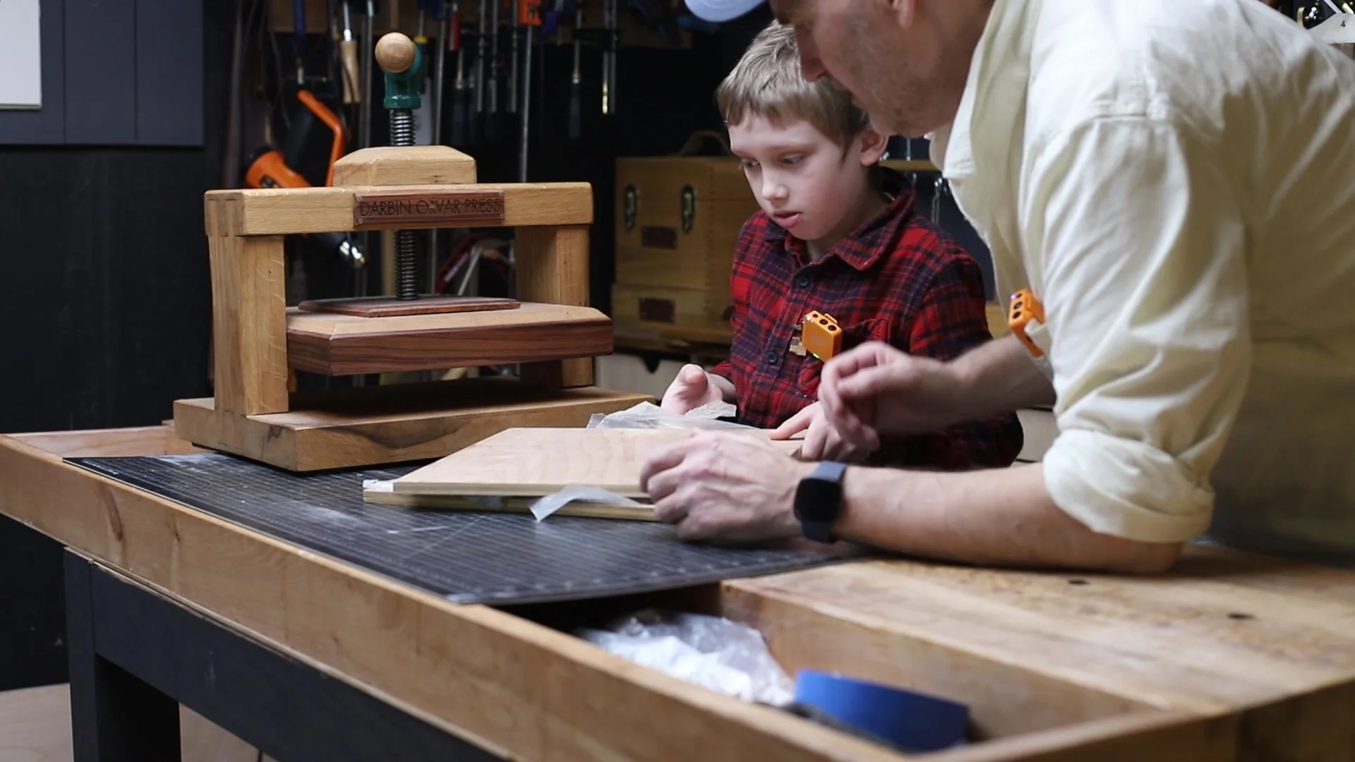 Removing the flattened signatures from the book press in the latest video