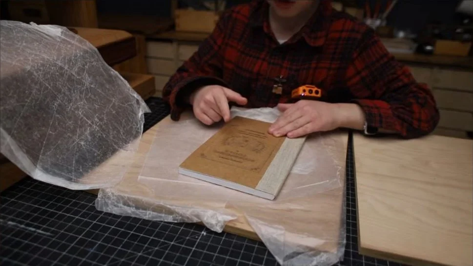 The finished book containing the plans for the tools used to bind it
