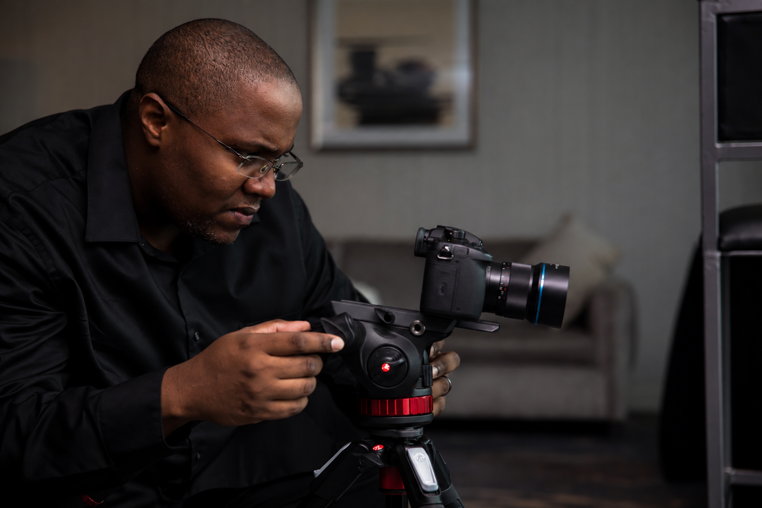 Thomas Brown adjusting his camera on a tripod