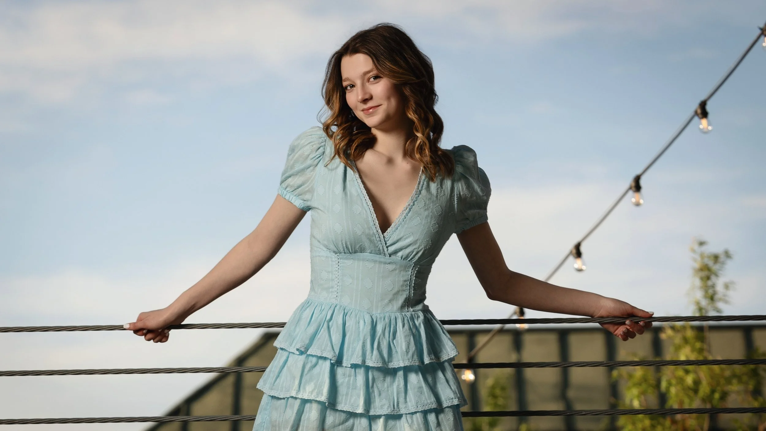 Fashion-forward senior portrait in a pale blue dress