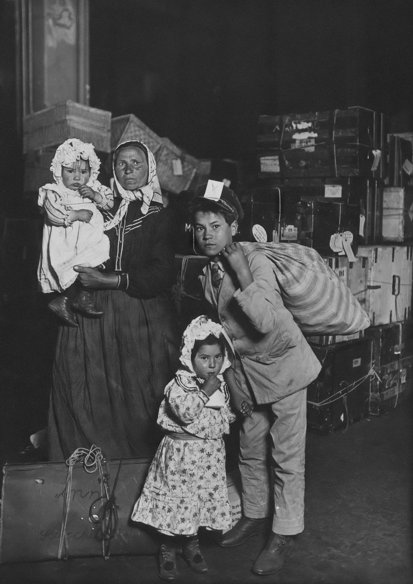 An Italian mother and her children in the Ellis Island baggage room