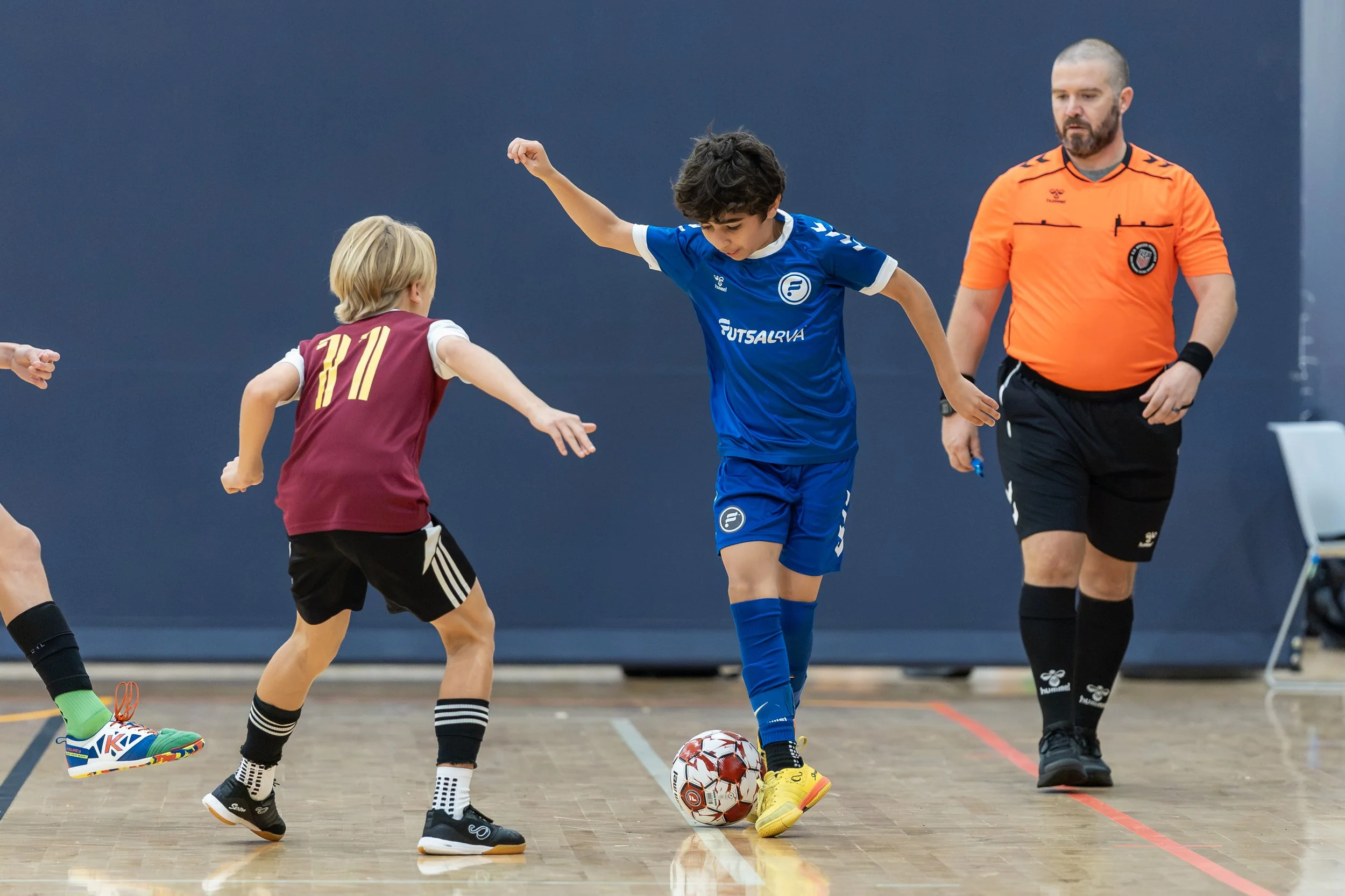 Boys team competing in a futsal tournament game