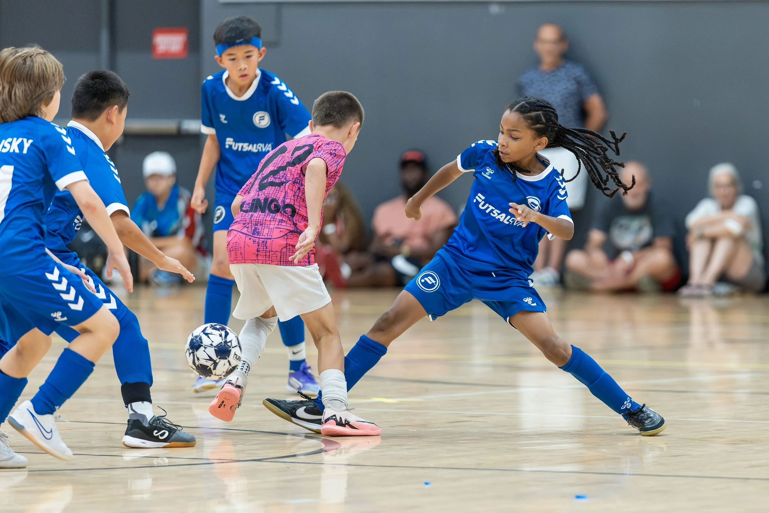 Boys futsal team competing in a tournament game