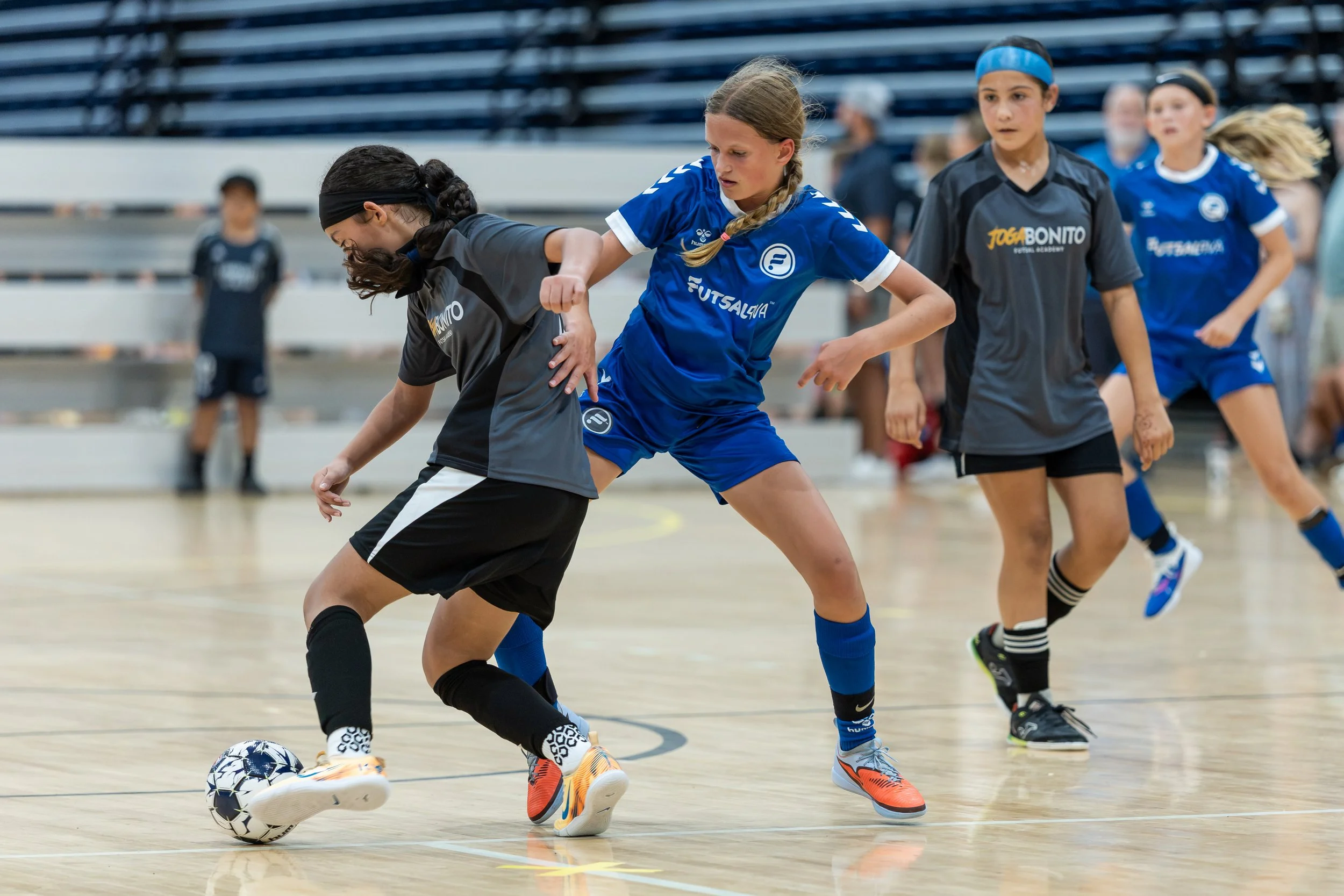 Girls futsal player in action during a tournament game