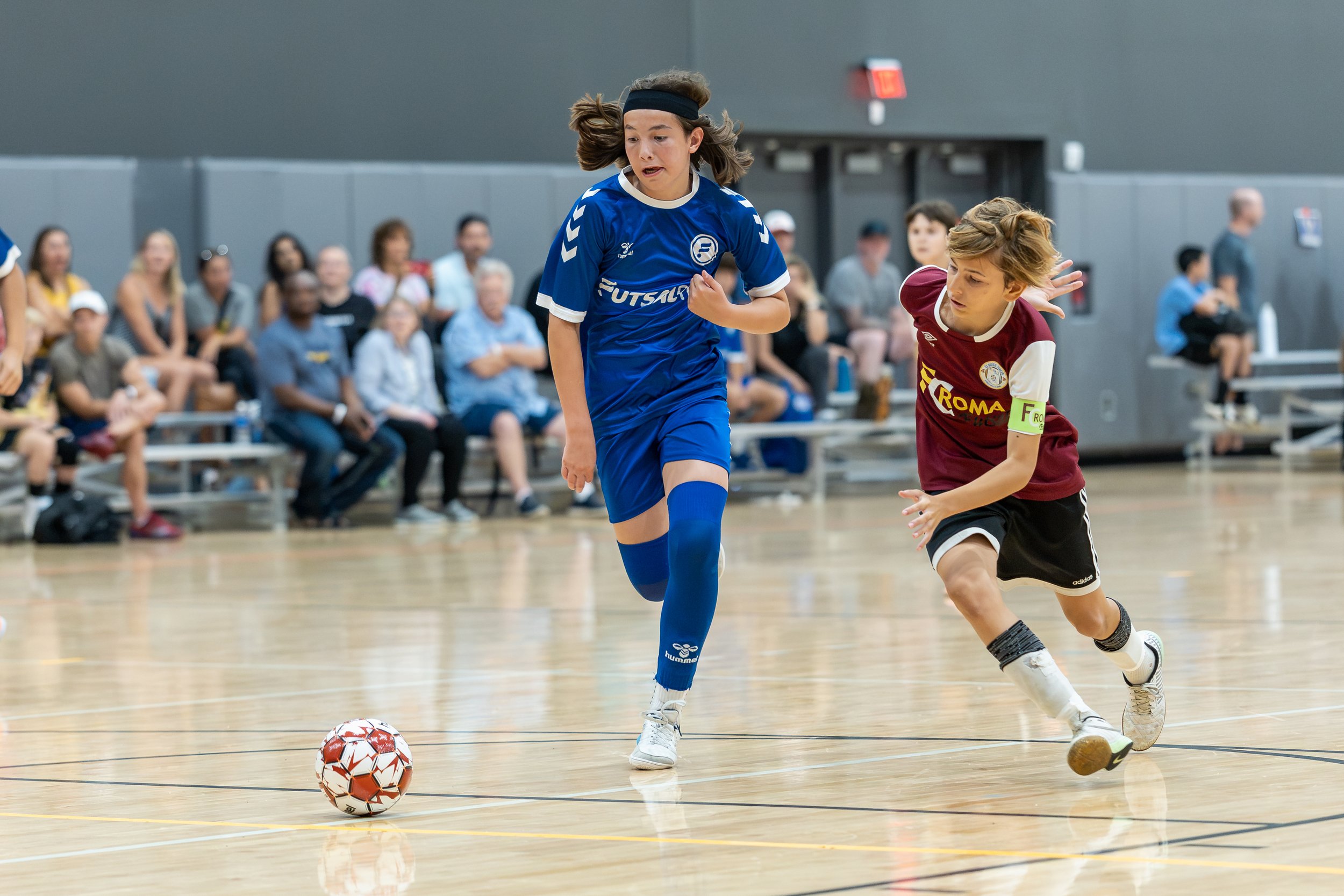 Boys futsal player in action during a tournament game