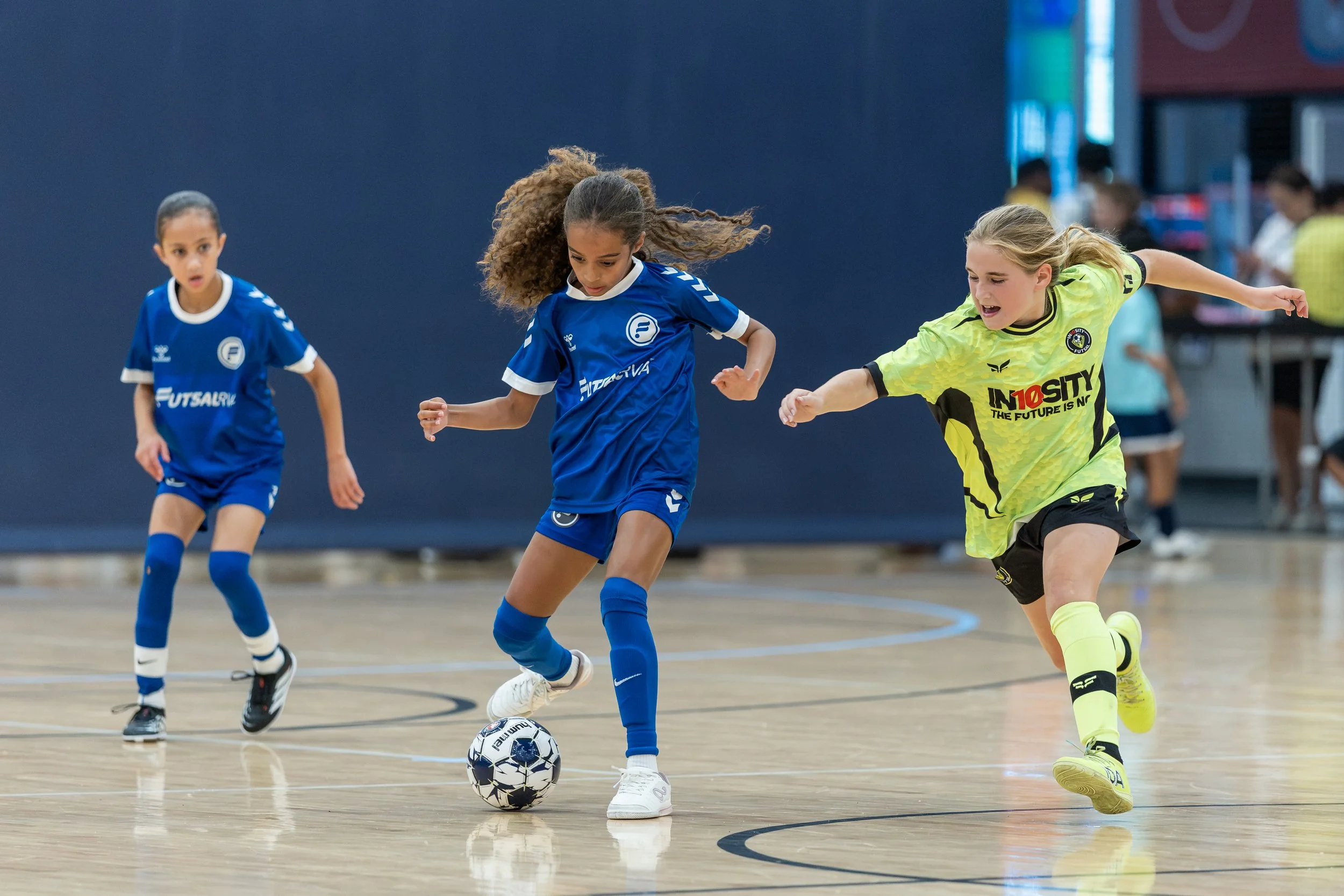 FutsalRVA Academy girls team in blue jerseys during a game