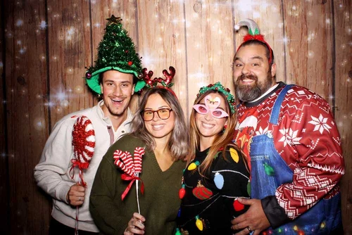 Holiday party photo booth with festive branded prints
