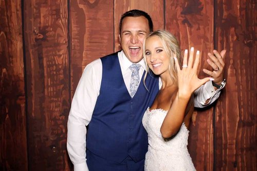 Couple at their wedding photo booth