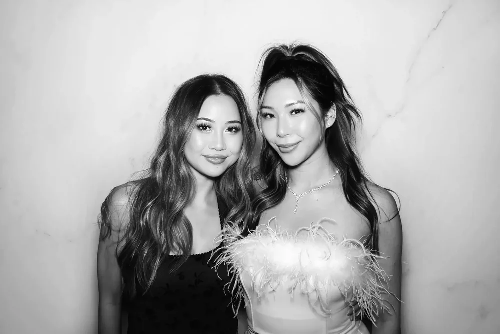 Guests using a photo booth at an Orange County venue