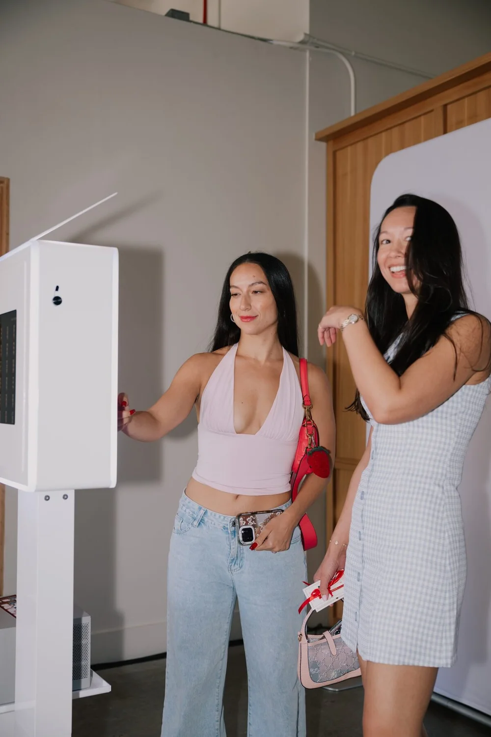 Two guests stepping up to the open-air photo booth at Ever Club, Tustin