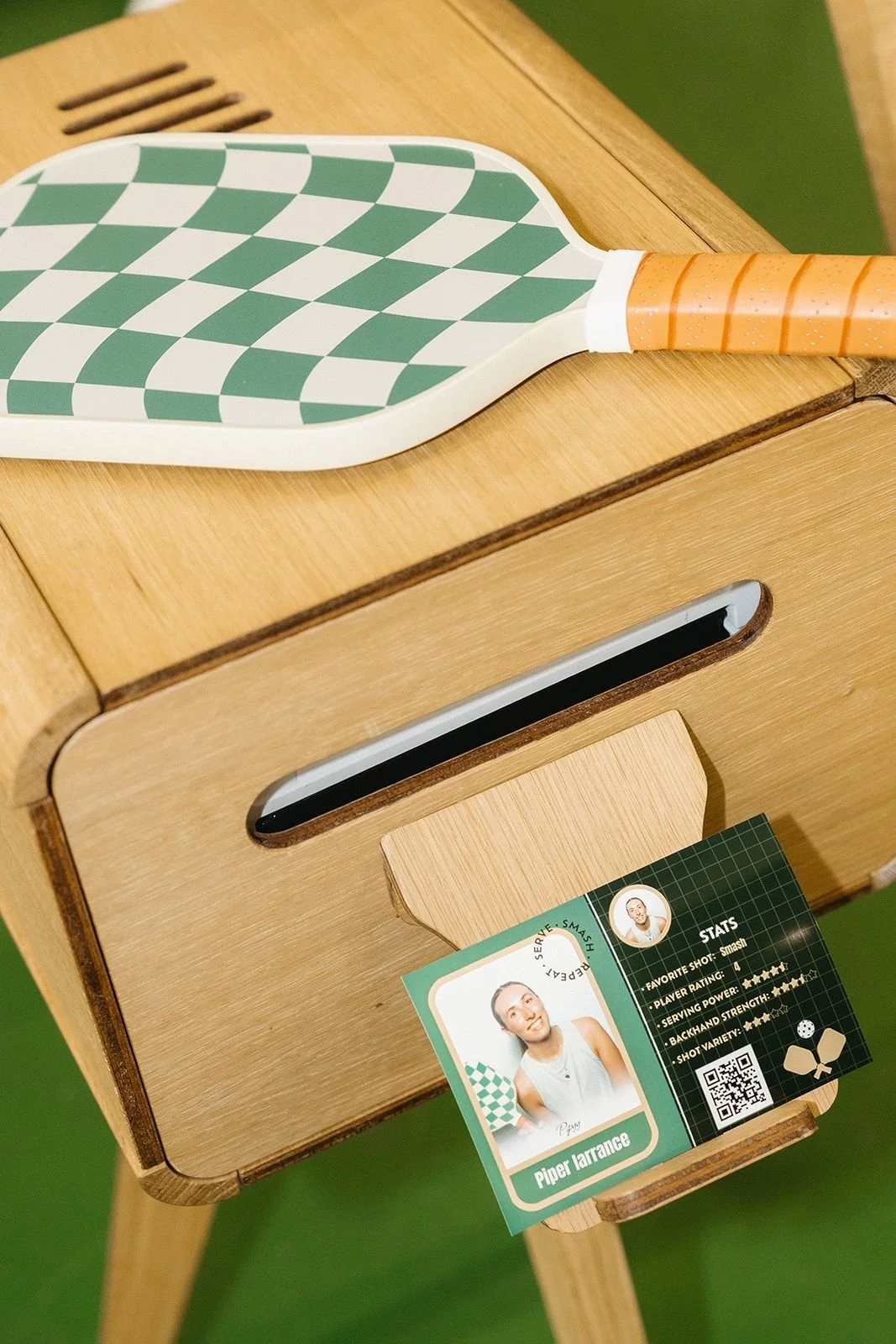 Custom photo trading card printing from a wooden photo booth at a pickleball event