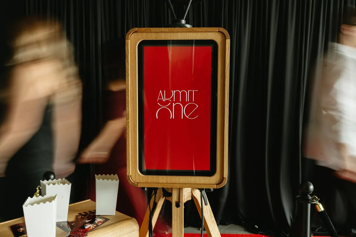 Photo booth showing a custom Admit One welcome screen at a movie premiere party