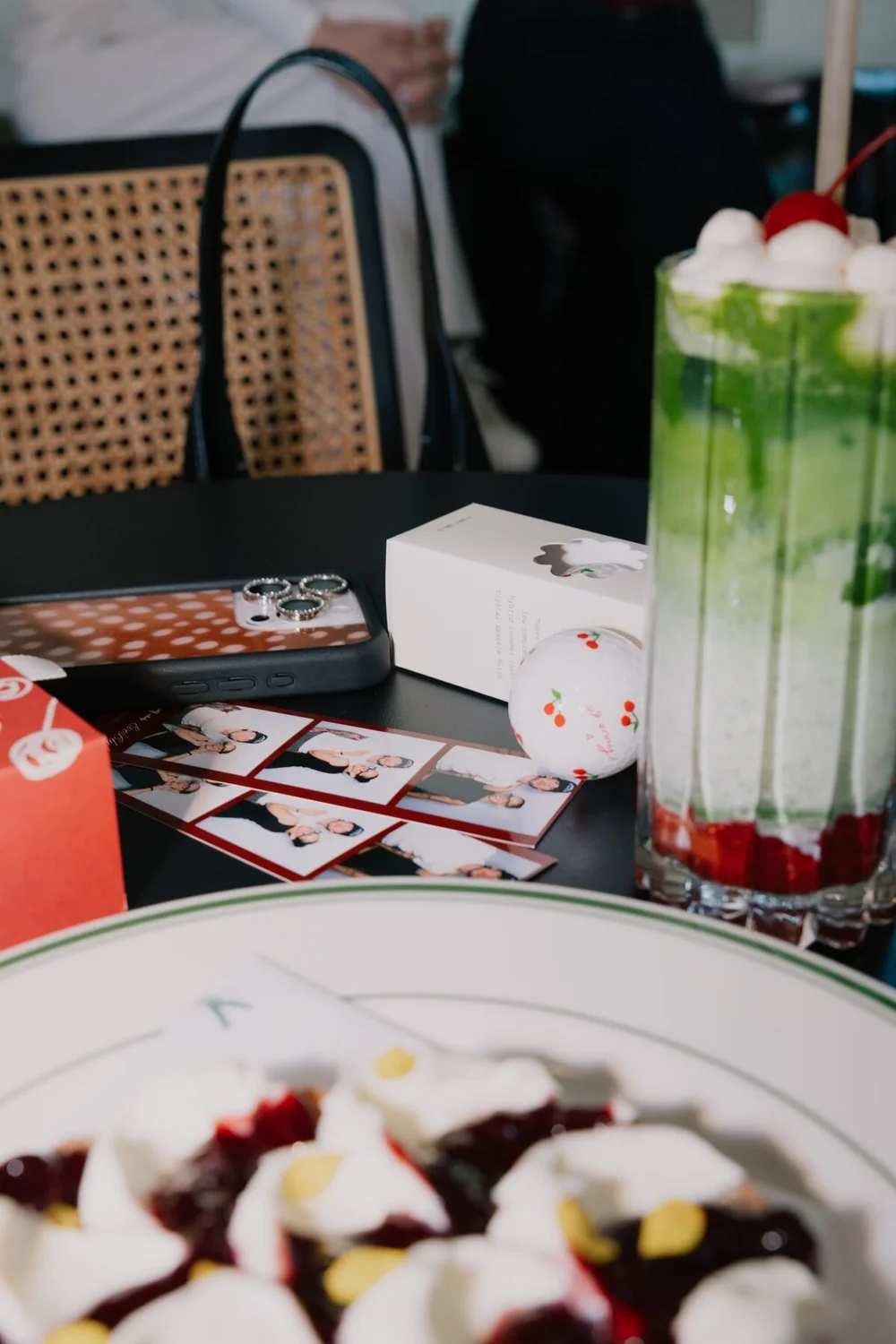 Matcha with a cherry on top beside Cherry Golf Club and Ever Club photo strips