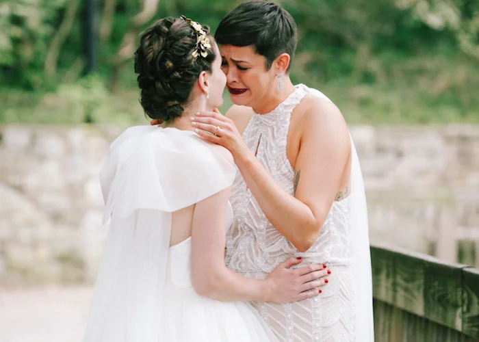newlywed couple standing in archway after their wedding