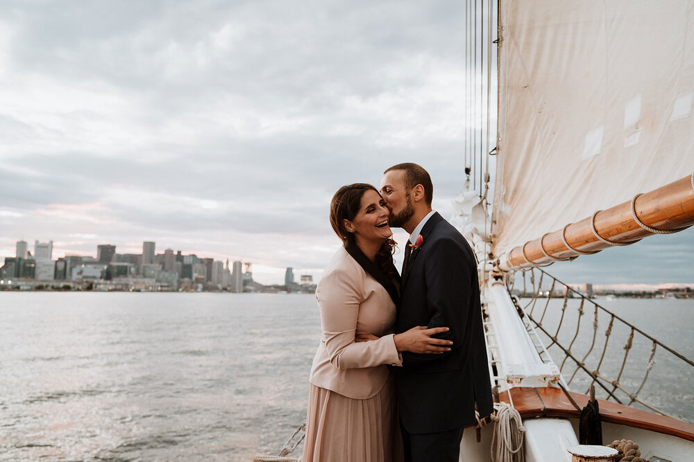 newlywed couple smiling after their wedding on a sailboat portland oregon