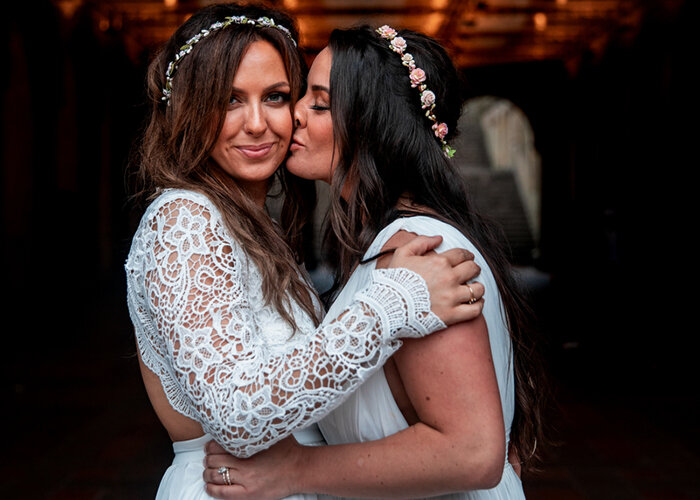 newlywed couple kiss on cheek after elopement in NYC Central Park