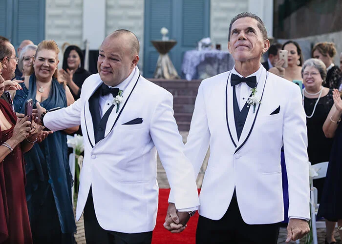 newlywed grooms walking down aisle and celebrating with guests Puerto Rico San Juan