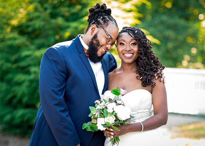 newlywed couple smile and embrace after Washington DC wedding Aimee Custis Photography