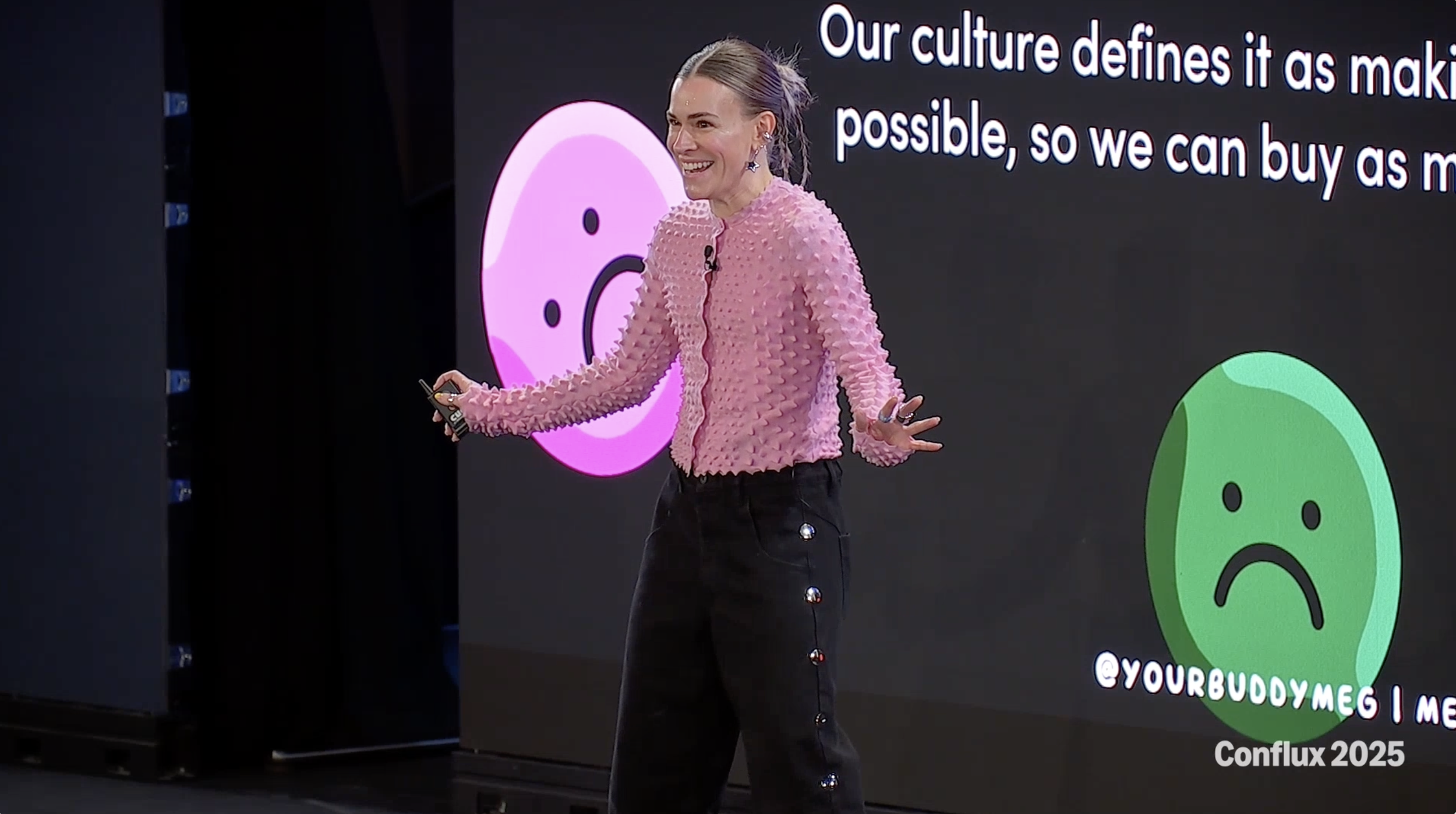 Meg Lewis on stage delivering a keynote