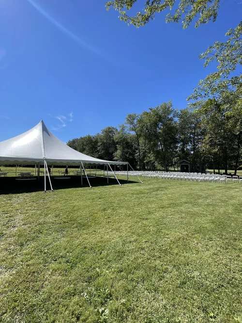 Pole tent with chairs