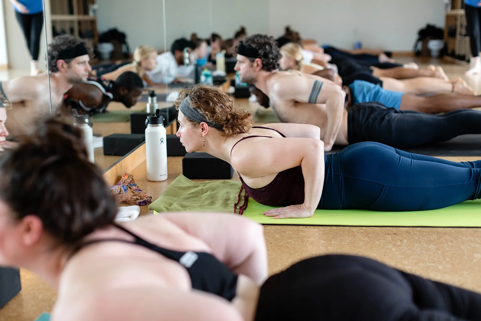 Students practicing in a heated class at Inner Fire Yoga open house