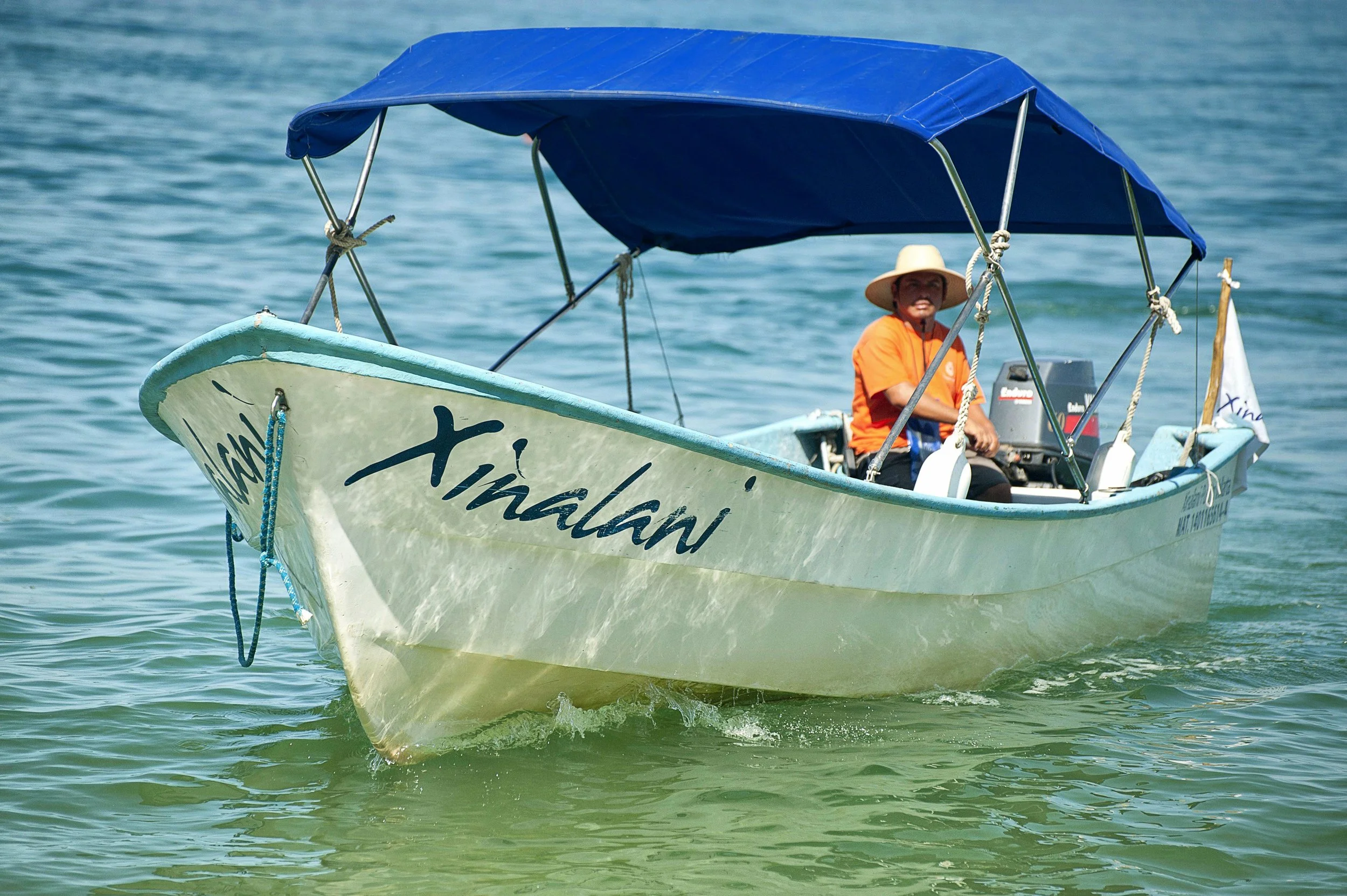 Xinalani charter boat on turquoise water