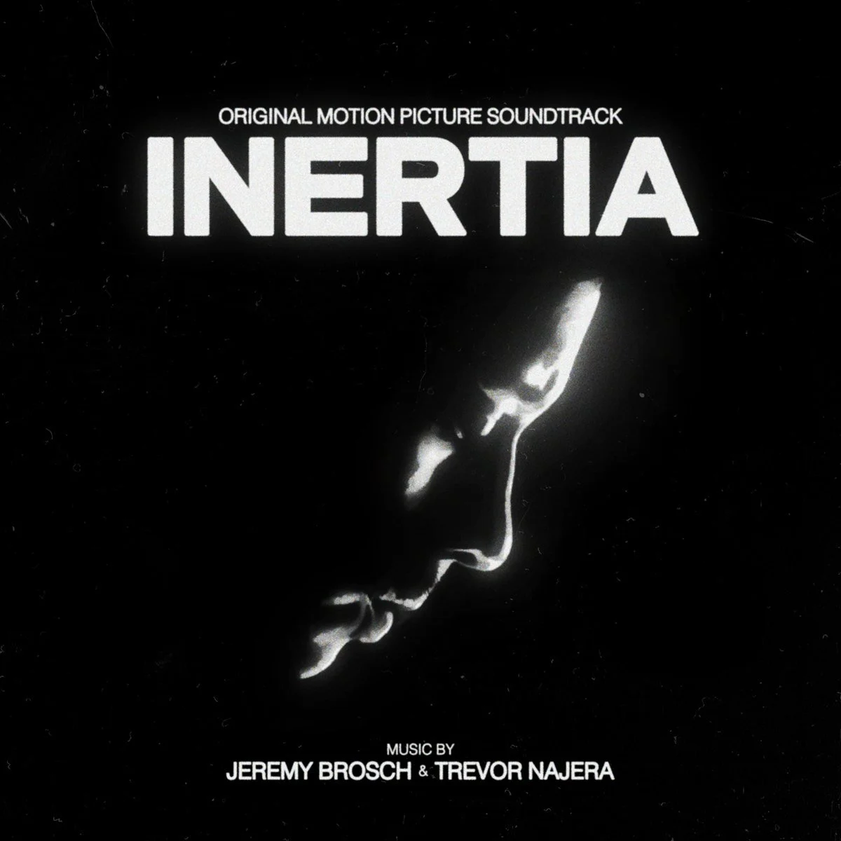 Cover of the INERTIA original motion picture soundtrack: the white title above a figure in white light on black. Music by Jeremy Brosch and Trevor Najera.