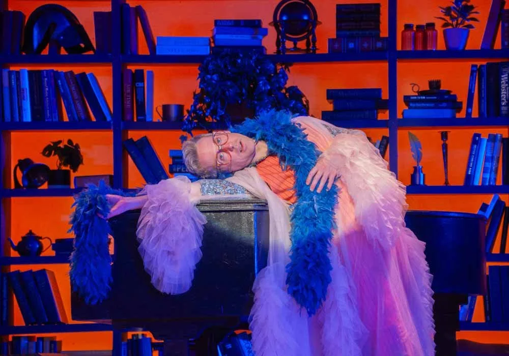 A performer in a feather boa during a special event