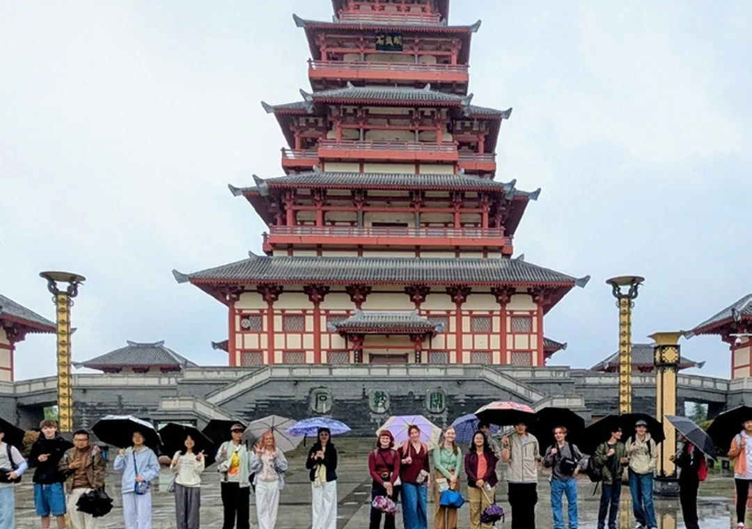 Watershed students in front of a pagoda during a May Term trip to China