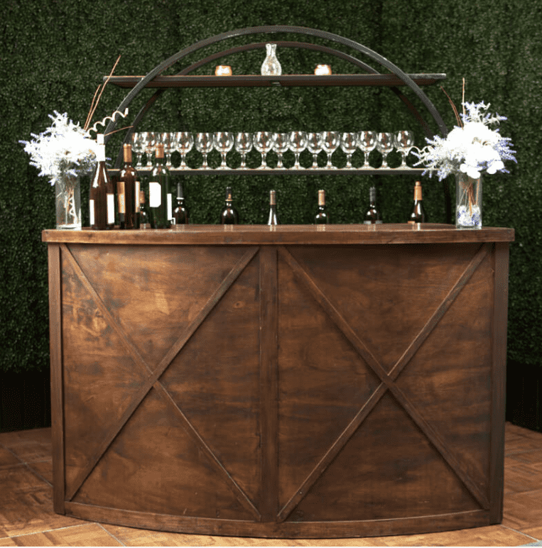 A fully set up event bar with staff, glassware and garnishes
