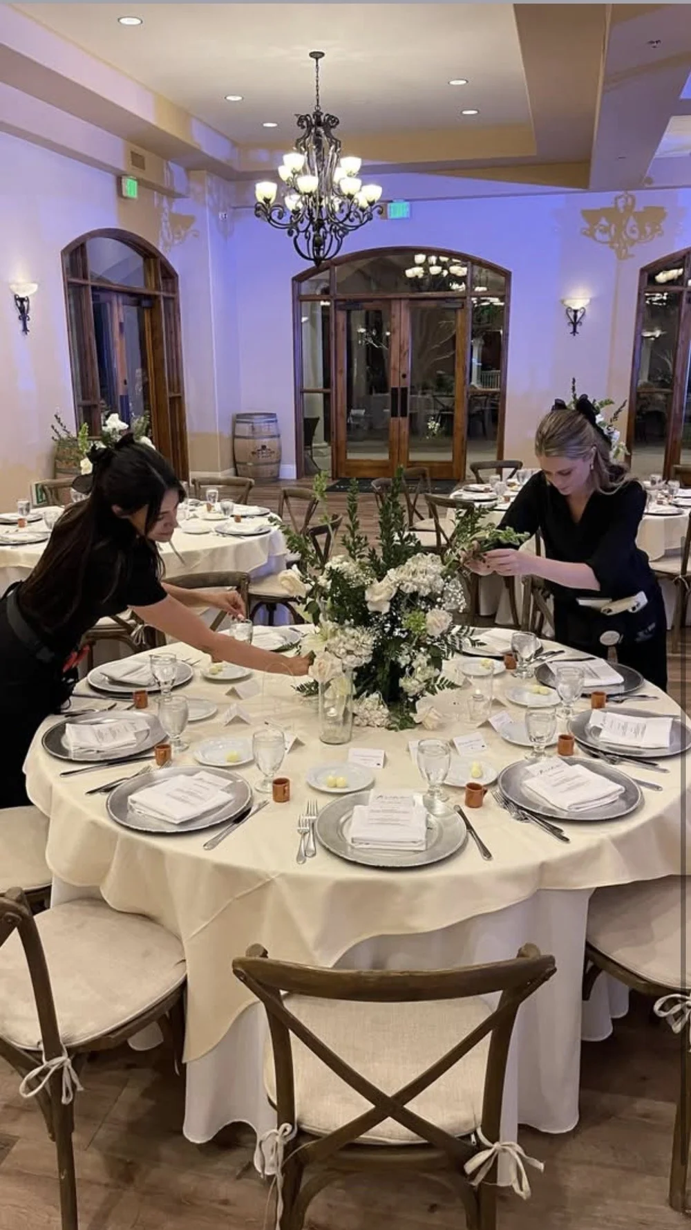 Platinum Bartenders event team setting a wedding reception table