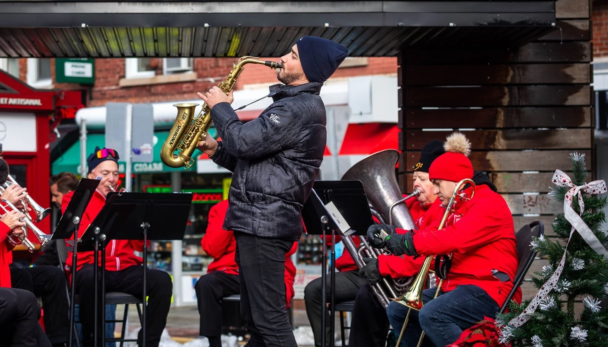 Saxophone player performing with The Salvation Army band at the Christmas Kettle Campaign launch