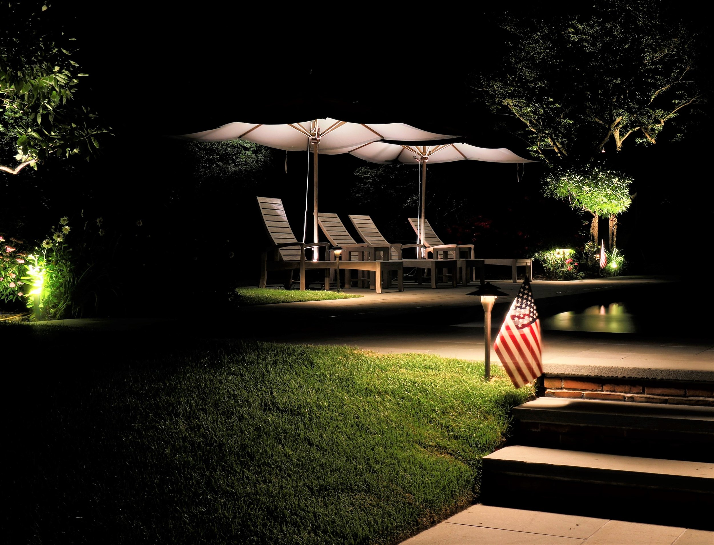 Warm patio and pathway lighting creating a relaxed mood for evening entertaining