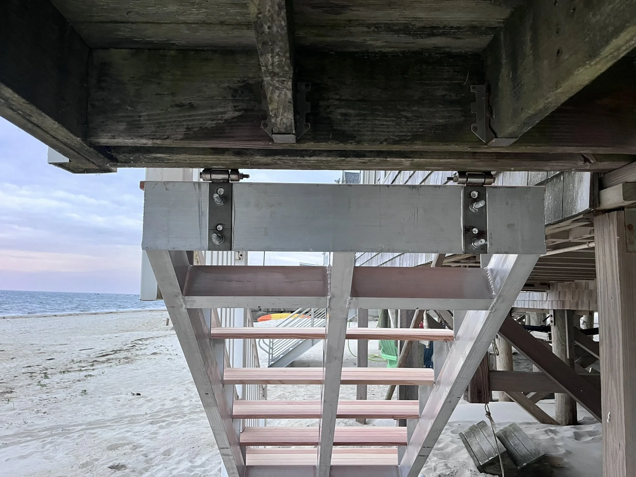 New aluminum top plate bolted to existing deck framing from below