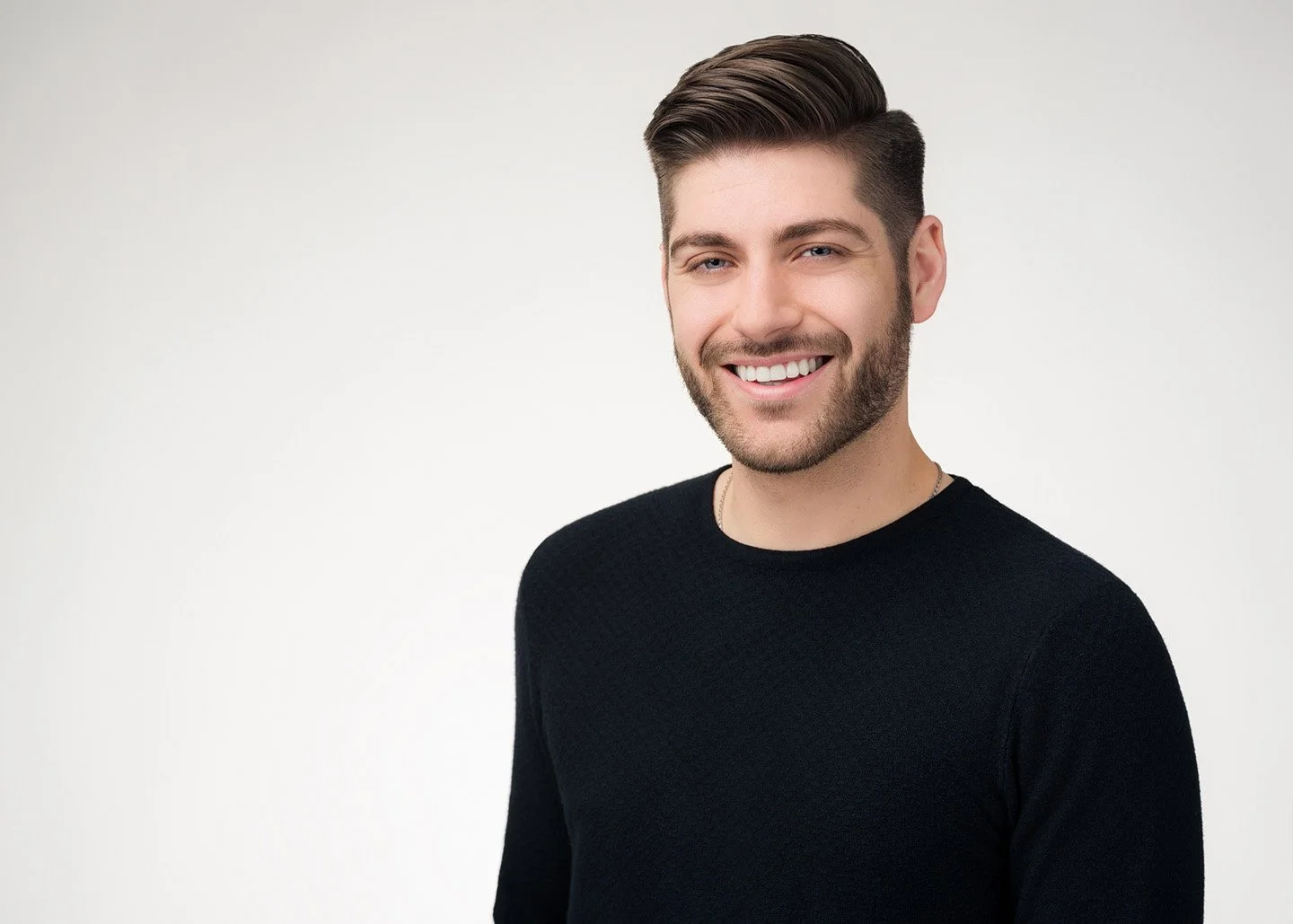 Express Studio Session headshot example — professional male portrait on dark background