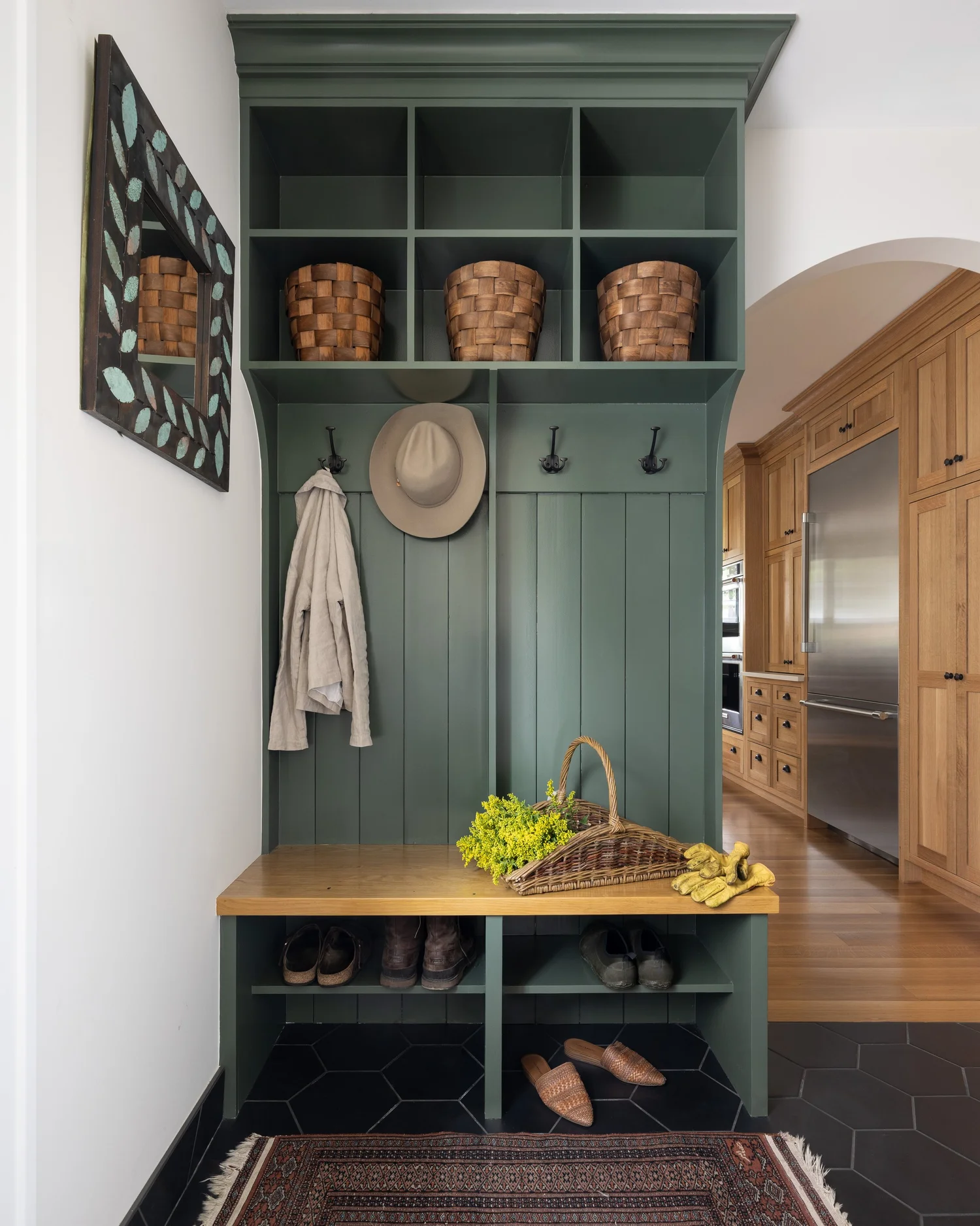 Mudroom bench and cubbies, open to the kitchen