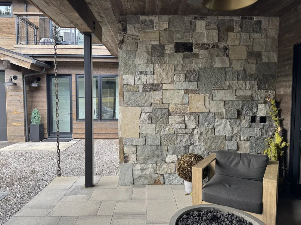 Canyon River full veneer in split and natural faces across a mountain-home facade.