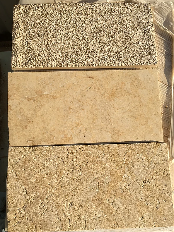Cream paving swatches comparing bush-hammered, honed, and brushed finishes side by side.