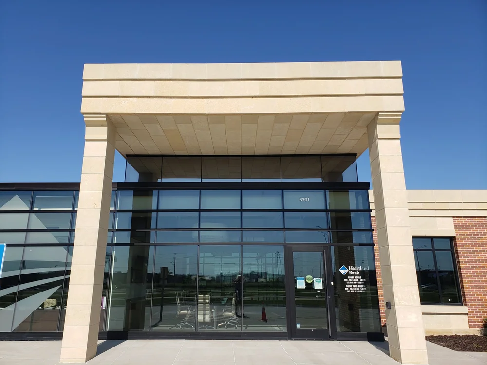 Silverdale panel veneer in a honed face across a bank facade.