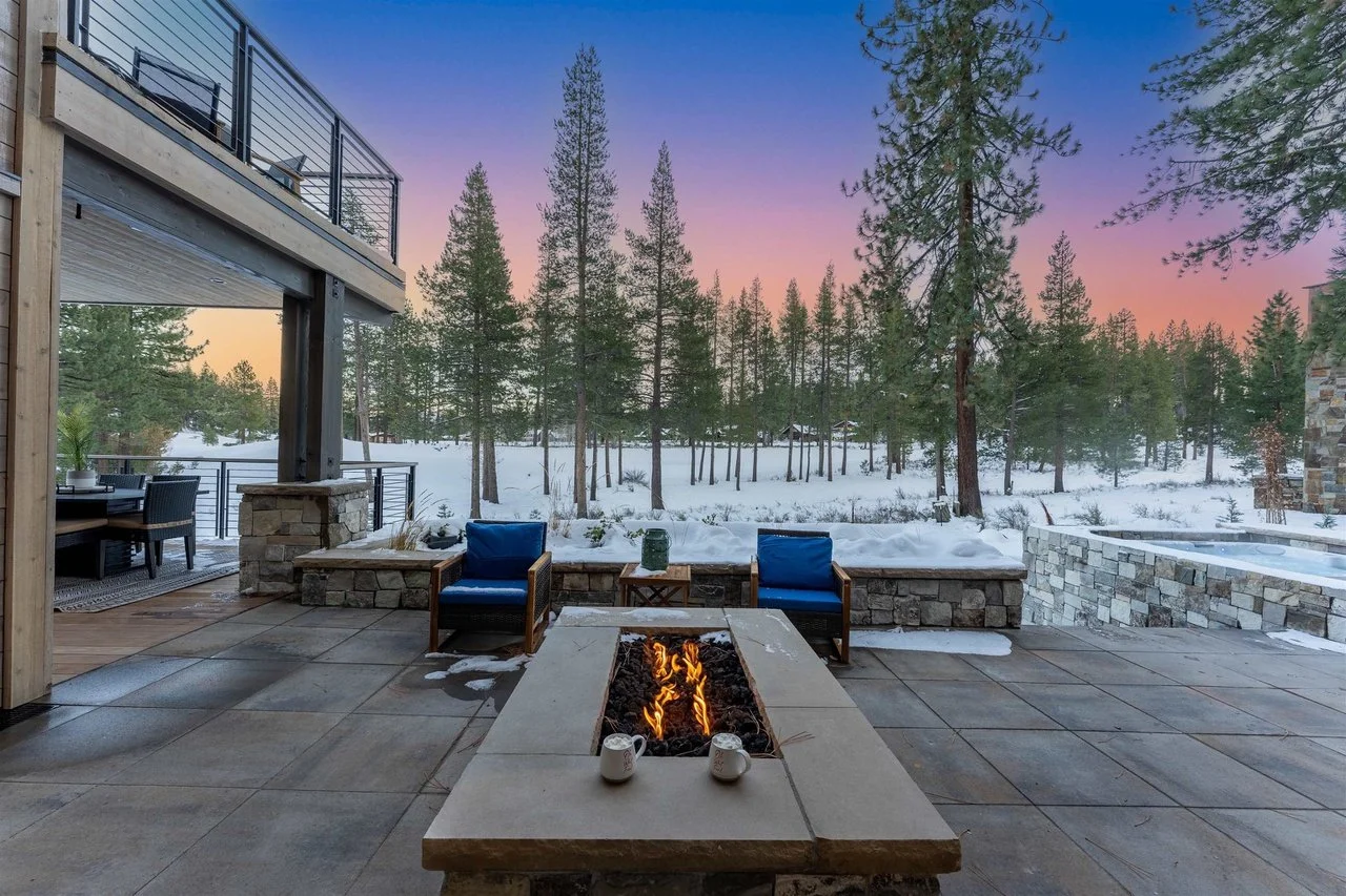 Canyon River veneer and honed Indiana Limestone wall caps on a patio fire feature.