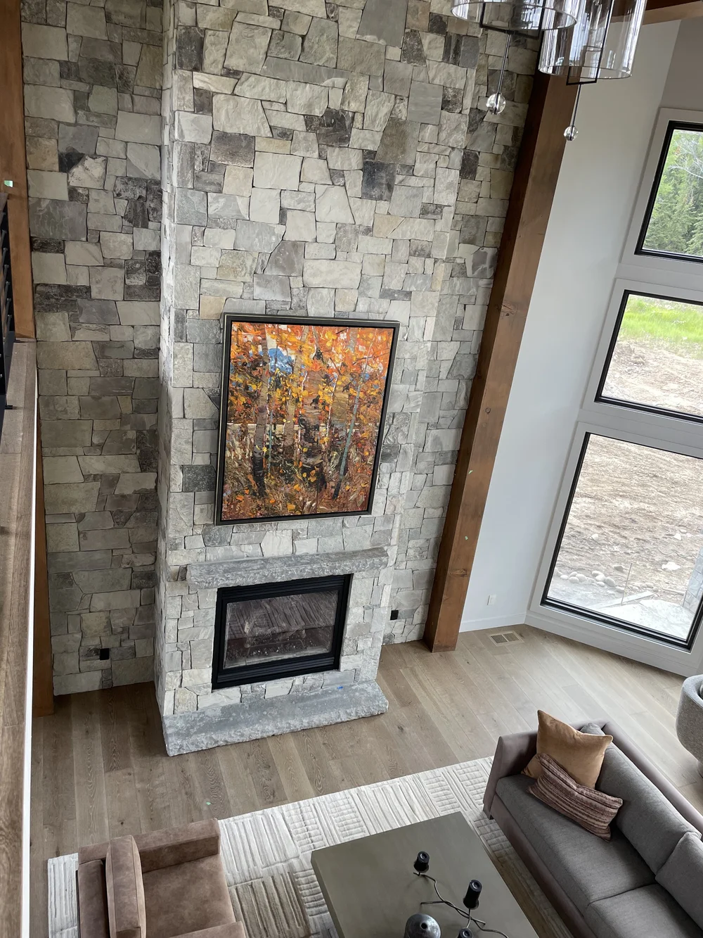 Canyon River full veneer rising up an interior fireplace in split and natural faces.