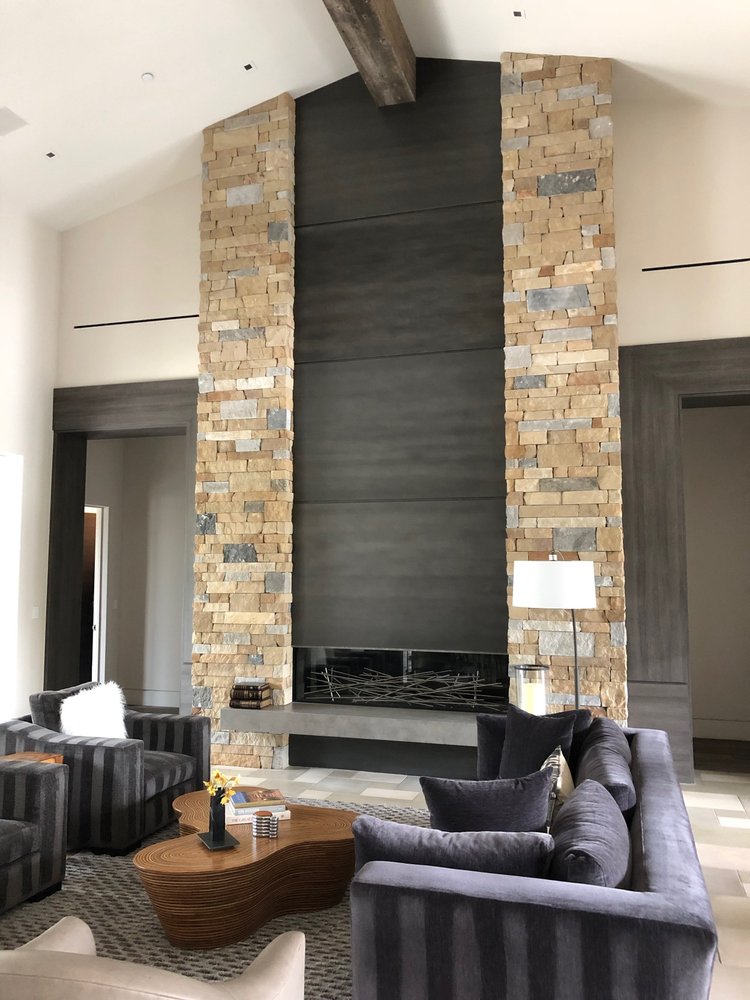 Napa Valley Estate ashlar veneer with split and natural faces and dry-stack joints on an interior fireplace surround.