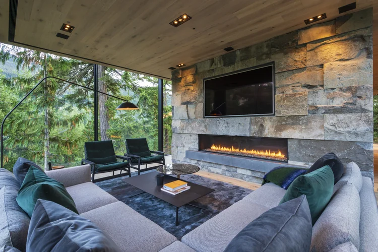 Whistler Basalt panel veneer in a natural face with dry-stack joints framing an interior fireplace.