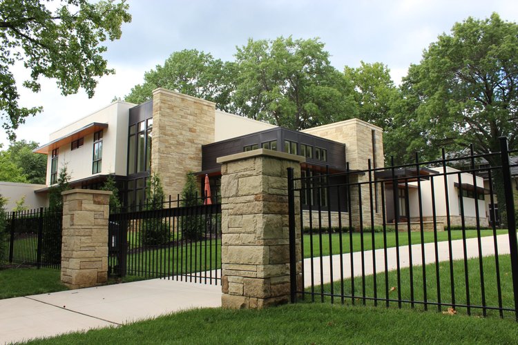 Prairie Shell split-face ashlar veneer topped with honed wall caps.