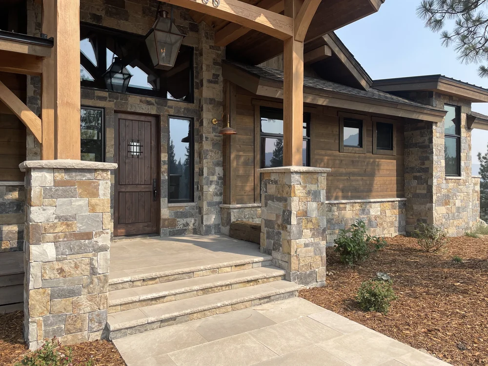 Aspen Estate veneer, Indiana Limestone pavers, and Indiana Limestone column caps, sills, and wainscot caps on an entry.
