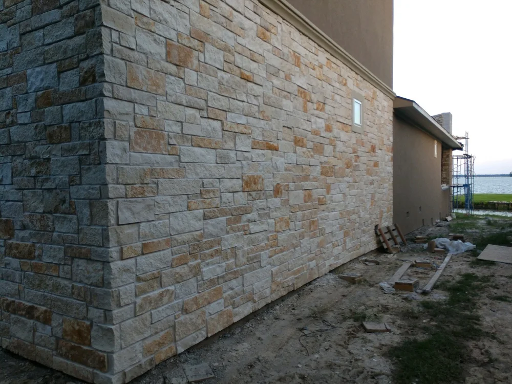 Split-face Rustic Earth ashlar veneer across a facade.