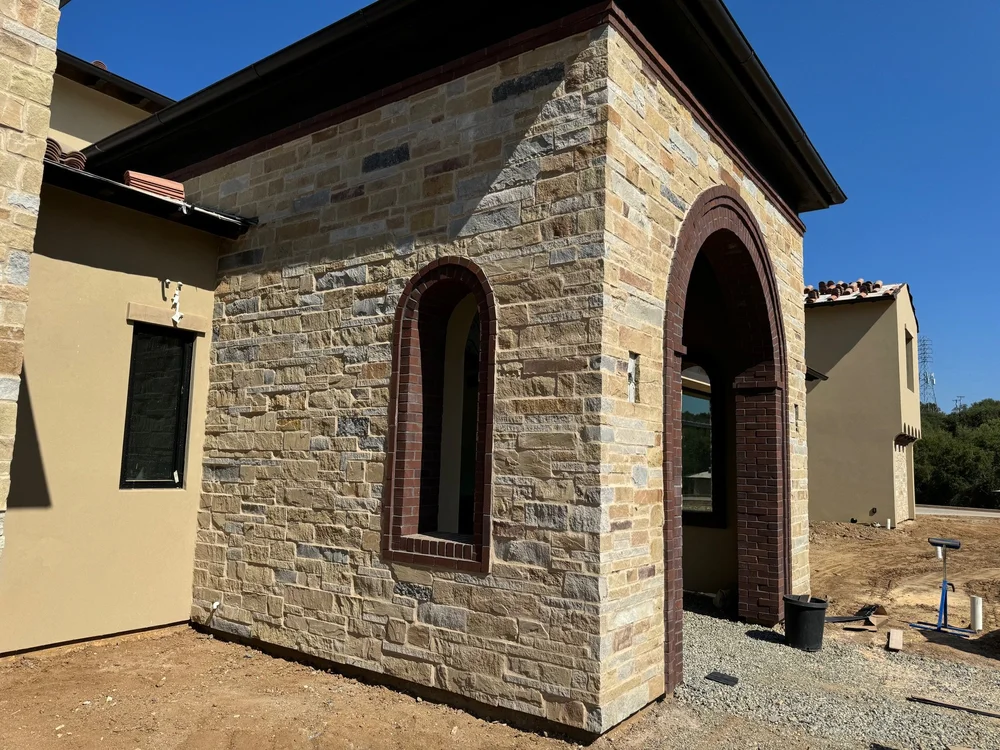 Napa Valley Estate ashlar veneer with overgrout joints wrapping a home facade and entry.