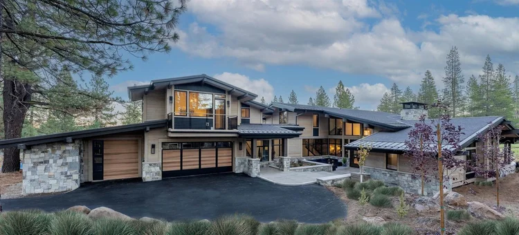 Canyon River veneer framing an entry, with honed Indiana Limestone wainscot and wall caps.