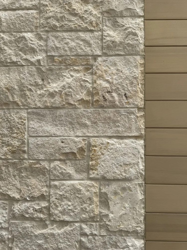Sea Fossil ashlar veneer in split and natural faces with flush joints across a facade.