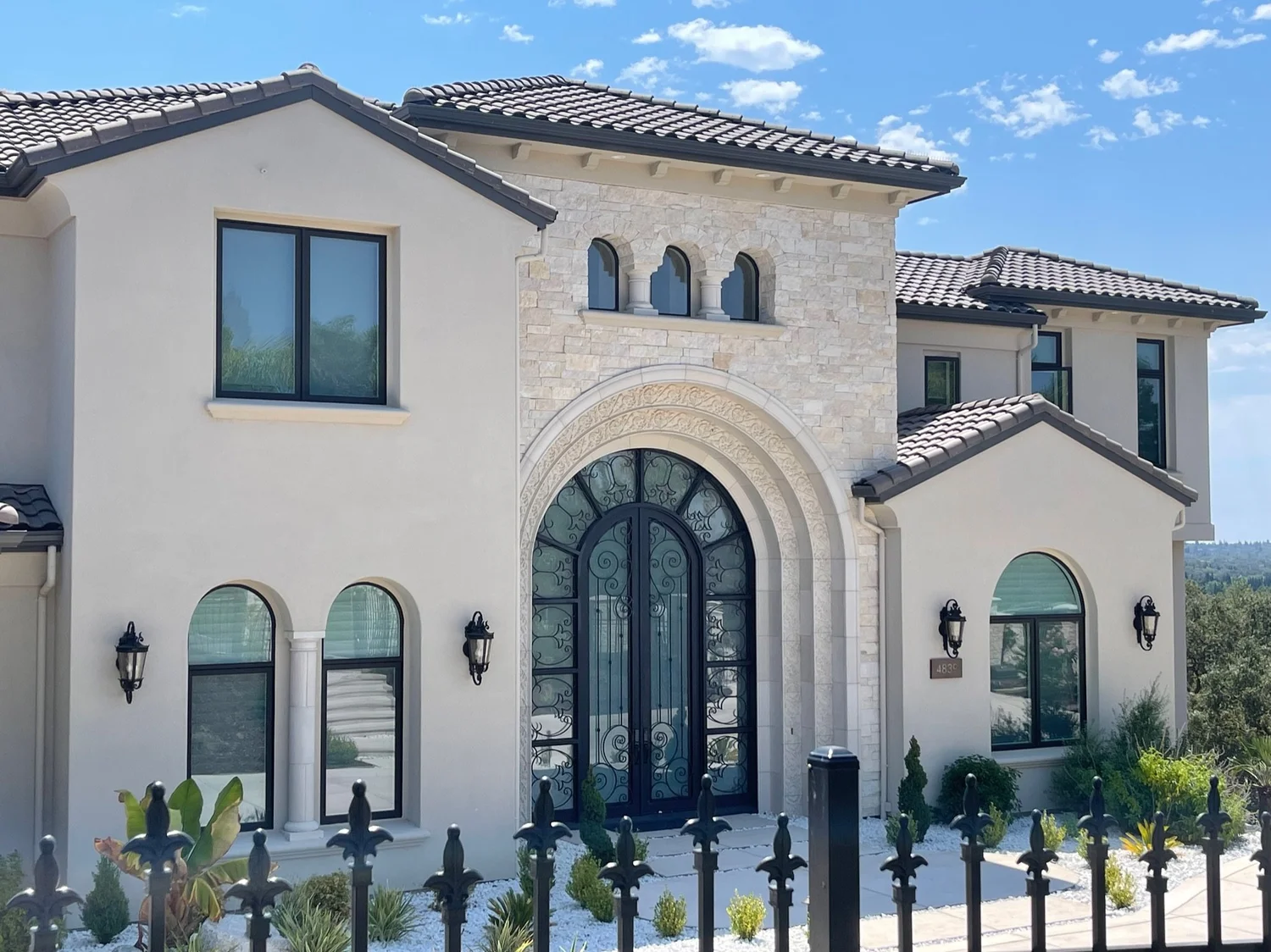 Sea Fossil ashlar veneer in split and natural faces with dry-stack joints at a facade entry.